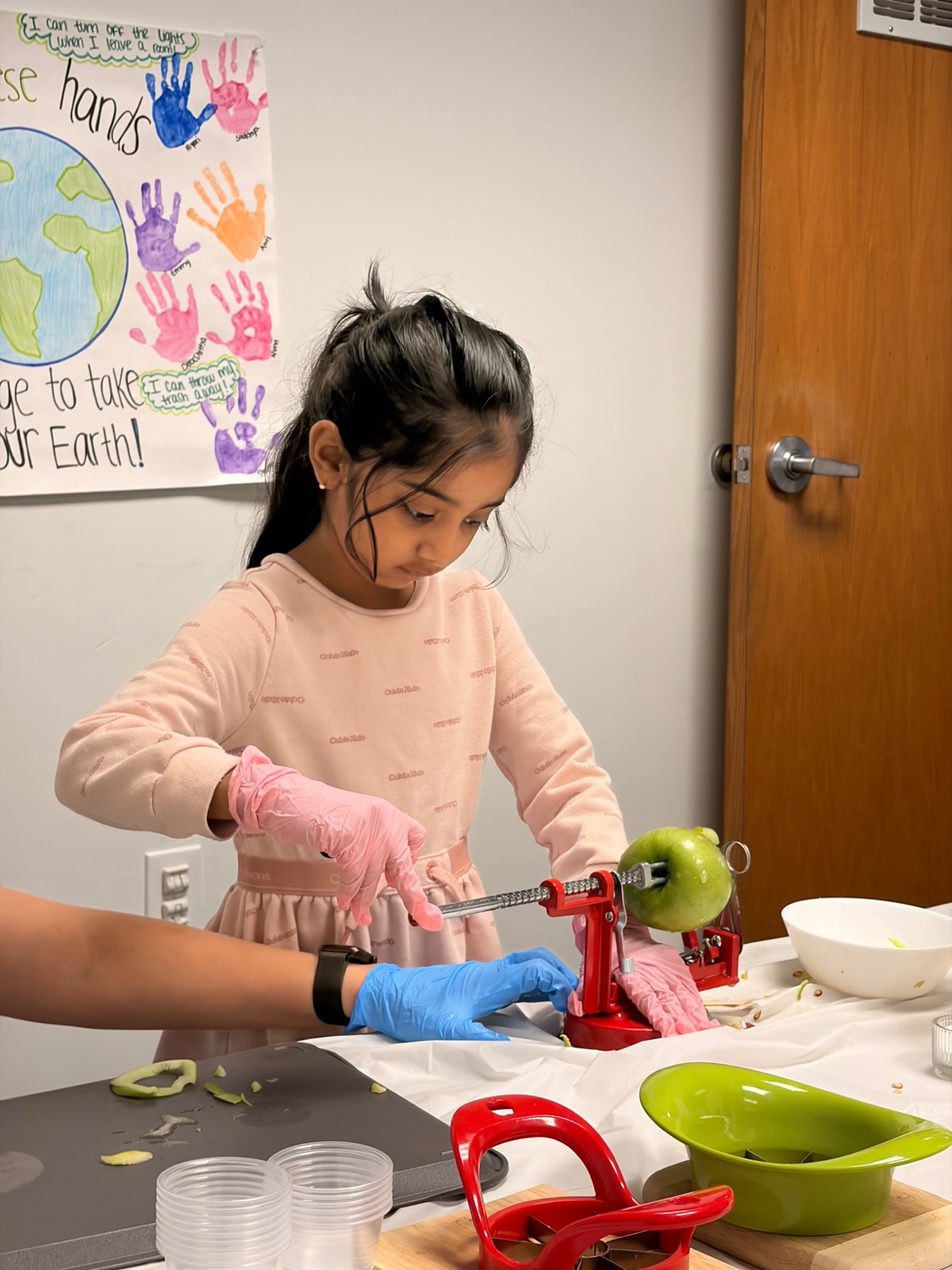 child peeling an apple, practical life